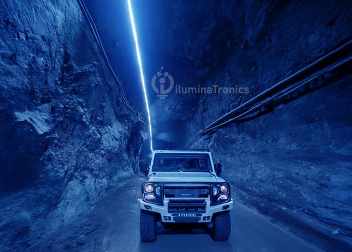 Underground mining tunnel illuminated with blue LED strip lighting
