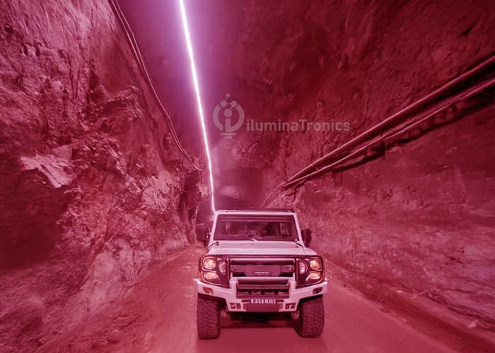 Underground mining tunnel illuminated with red LED strip lighting